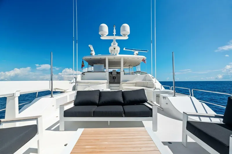 Slide: The Image of Luxurious 2011 Westport yacht deck with seating, ocean view, and clear blue sky. - 23