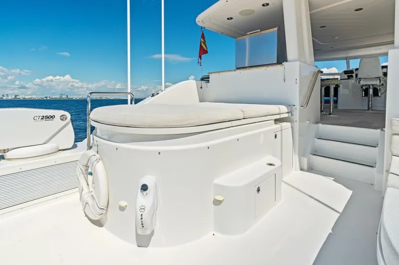 Slide: The Image of Luxurious 2011 Westport yacht deck with seating, ocean view, and clear blue sky. - 26