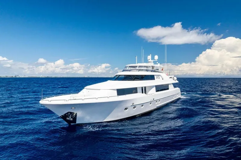 Slide: The Image of Luxurious 2011 Westport yacht cruising on open blue ocean under clear sky. - 3