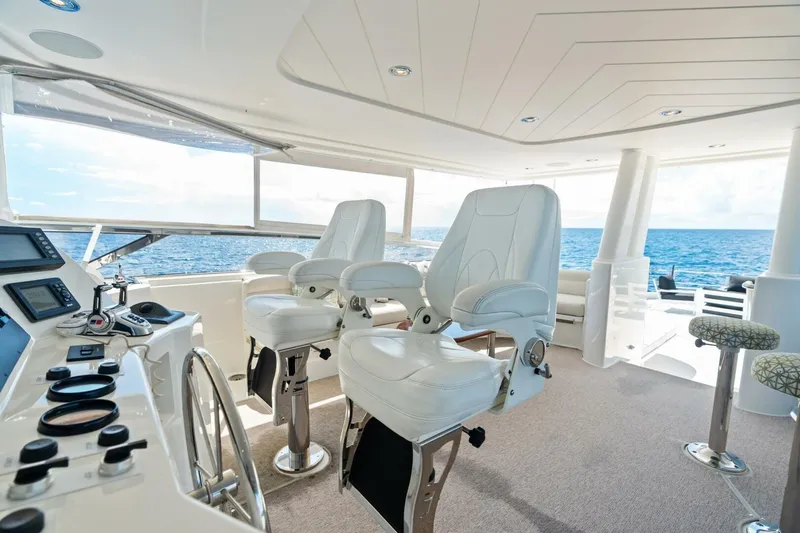 Slide: The Image of Luxurious 2011 Westport yacht helm with white captain chairs and ocean view. - 33