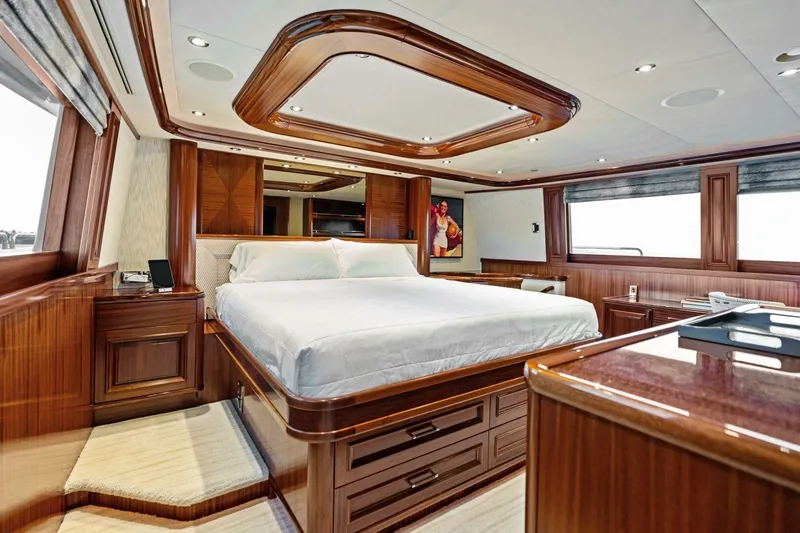 Slide: The Image of Luxurious 2011 Westport yacht bedroom with elegant wood finishes and large windows. - 46