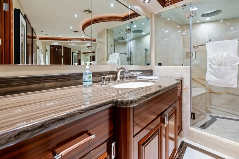 Slide: The Image of Luxurious 2011 Westport yacht bathroom with elegant wood cabinetry and marble countertops. - 49