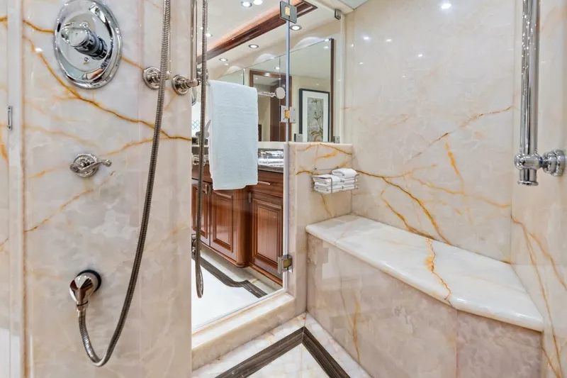 Slide: The Image of Luxurious marble shower in 2011 Westport yacht, featuring elegant fixtures and seating. - 50