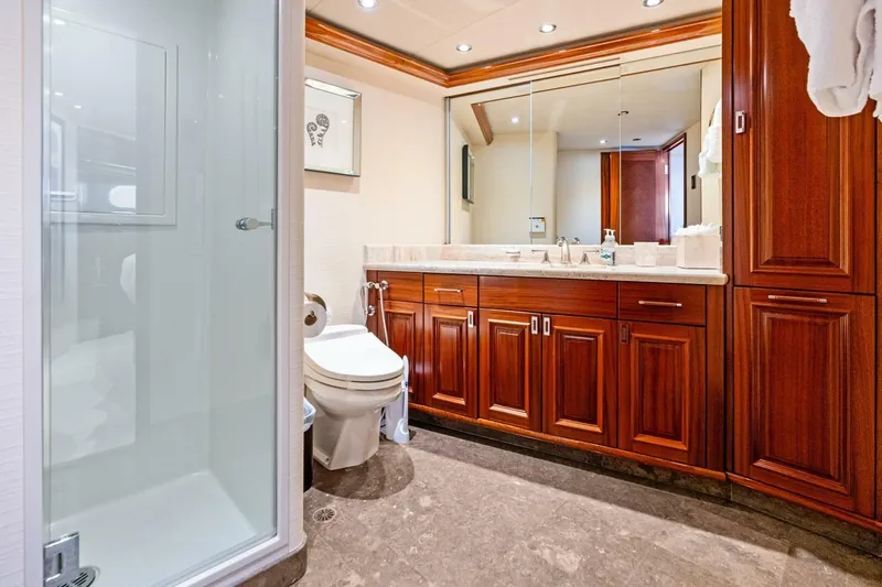 Slide: The Image of Luxurious 2011 Westport yacht bathroom with wooden cabinetry and glass shower. - 53