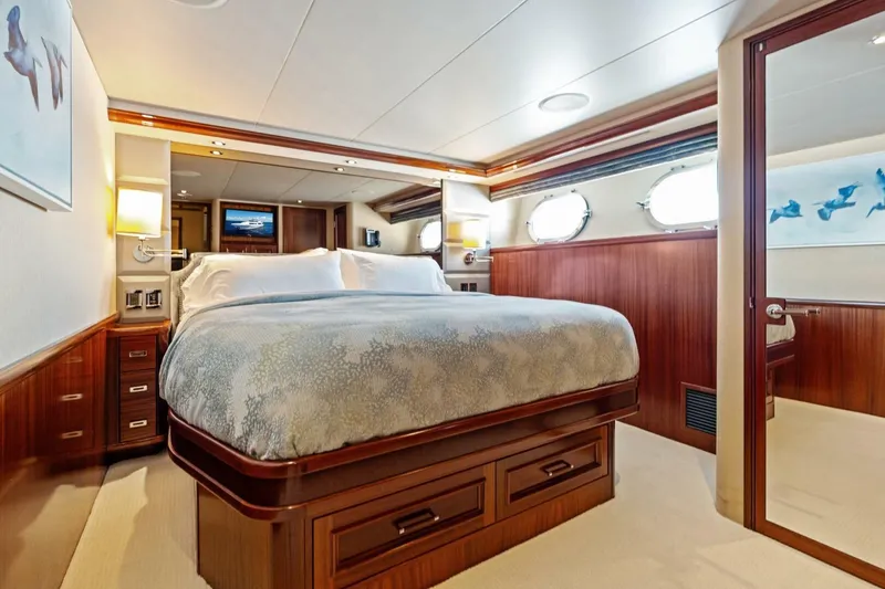 Slide: The Image of Luxurious bedroom interior of a 2011 Westport yacht with elegant wood finishes. - 54