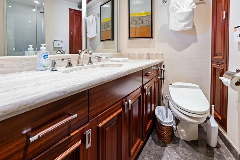 Slide: The Image of Luxurious 2011 Westport yacht bathroom with marble countertop and elegant wood cabinetry. - 56
