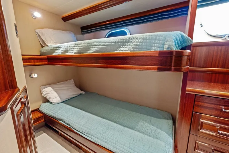 Slide: The Image of Luxurious 2011 Westport yacht cabin with wooden bunk beds and elegant furnishings. - 60