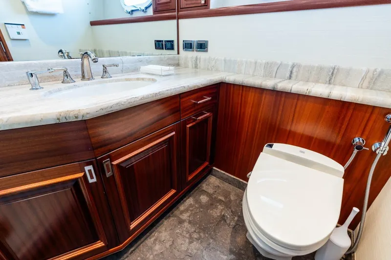 Slide: The Image of Luxurious 2011 Westport yacht bathroom with marble countertop and elegant wood cabinetry. - 63