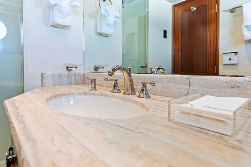 Slide: The Image of Luxurious bathroom sink with marble countertop and elegant fixtures on a 2011 Westport model. - 64