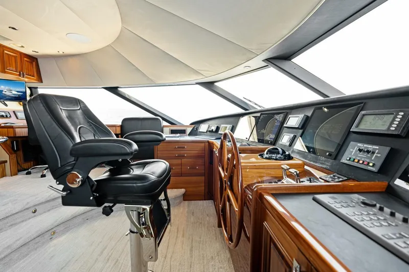 Slide: The Image of Luxurious 2011 Westport yacht helm with leather captain's chair and advanced navigation controls. - 66