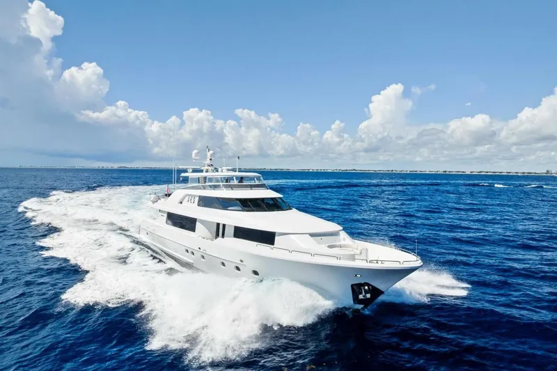 Slide: The Image of Luxurious 2011 Westport yacht cruising on open ocean under clear blue sky. - 7