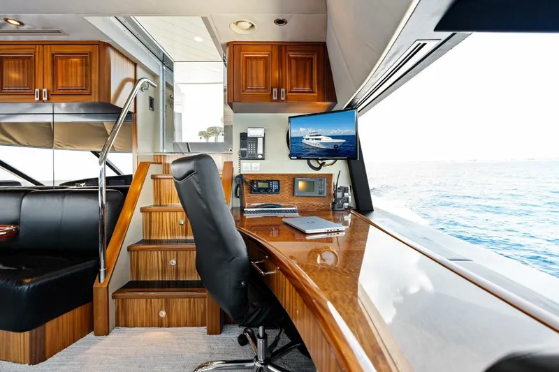 Slide: The Image of Luxurious 2011 Westport yacht interior with wooden cabinetry, desk, and ocean view. - 70