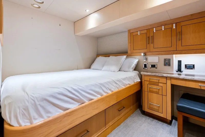 Slide: The Image of Luxurious 2011 Westport yacht bedroom with wooden cabinetry and cozy bedding. - 72