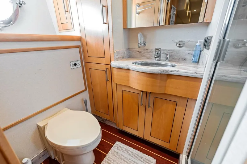Slide: The Image of Luxurious 2011 Westport yacht bathroom with wooden cabinetry and marble countertop. - 74