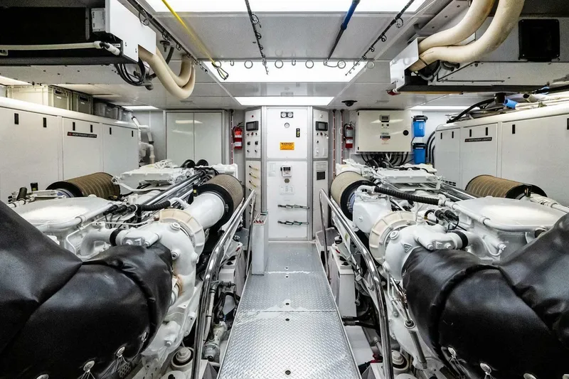 Slide: The Image of Engine room of a 2011 Westport yacht, featuring dual engines and advanced machinery. - 83