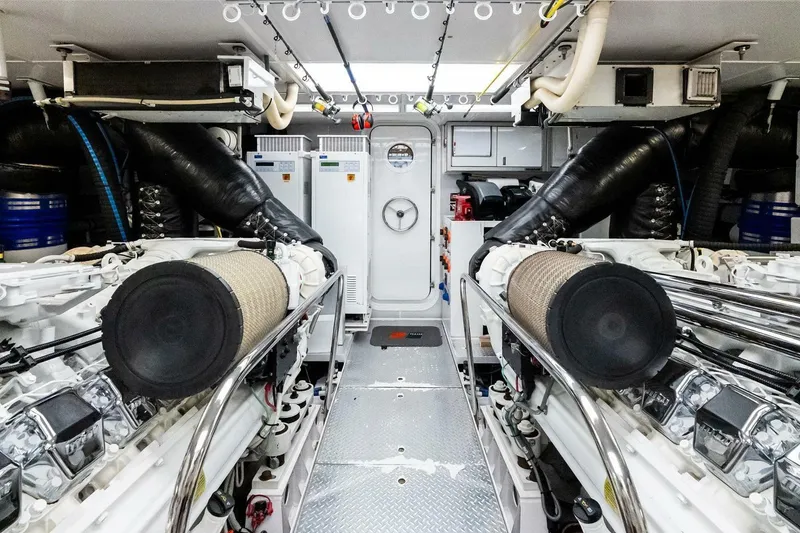 Slide: The Image of Engine room of a 2011 Westport yacht, featuring dual engines and advanced equipment. - 85