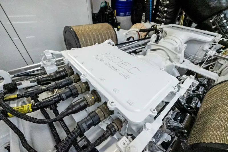 Slide: The Image of Engine compartment of a 2011 Westport, showcasing advanced mechanical components and wiring. - 88