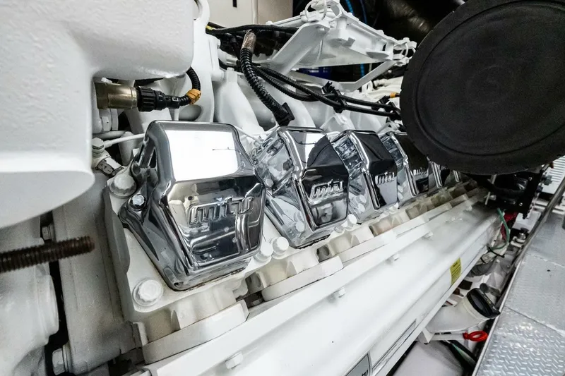 Slide: The Image of Close-up of a 2011 Westport engine with shiny chrome components and intricate wiring. - 89