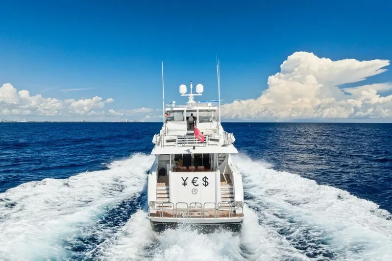 Slide: The Image of Luxurious 2011 Westport yacht cruising on open ocean under clear blue sky. - 9