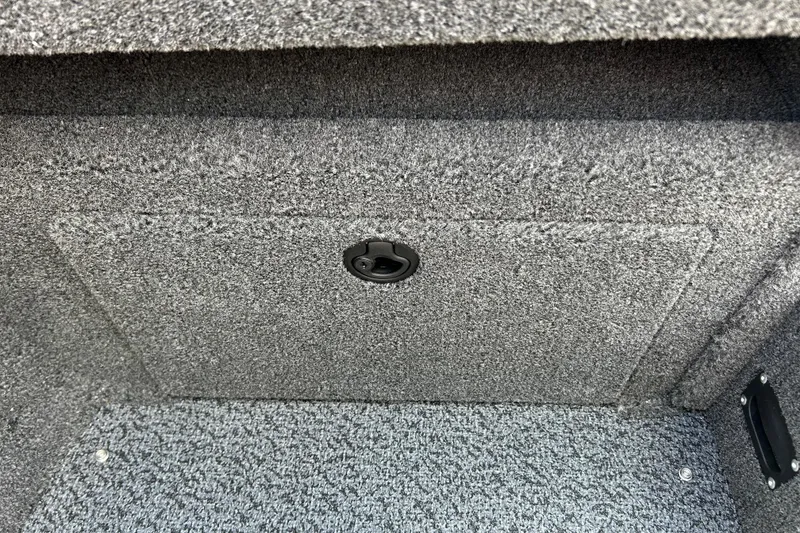 Slide: The Image of Carpeted storage compartment in 2026 Lund 1875 Crossover XS boat interior. - 11