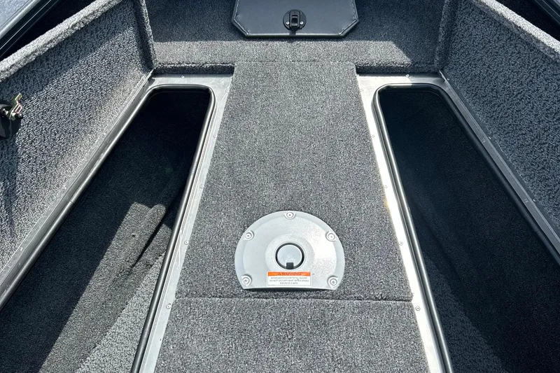 Slide: The Image of Interior view of 2026 Lund 1875 Crossover XS boat storage compartments. - 21