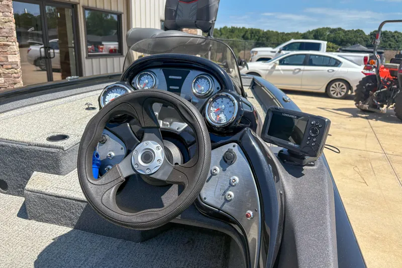 Slide: The Image of 2021 Tracker Pro Team 175 TXW boat dashboard with steering wheel and gauges. - 11