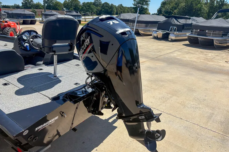 Slide: The Image of 2021 Tracker Pro Team 175 TXW boat with Mercury outboard motor in a marina setting. - 3