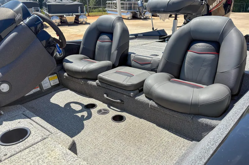 Slide: The Image of 2021 Tracker Pro Team 175 TXW boat interior with dual seats and steering wheel. - 8