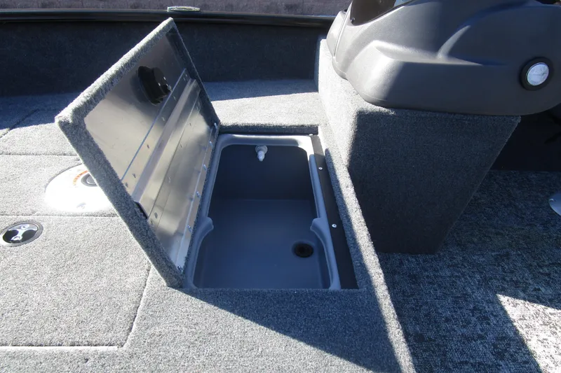 Slide: The Image of 2026 Tracker Super Guide V-16 boat interior with open storage compartment. - 6