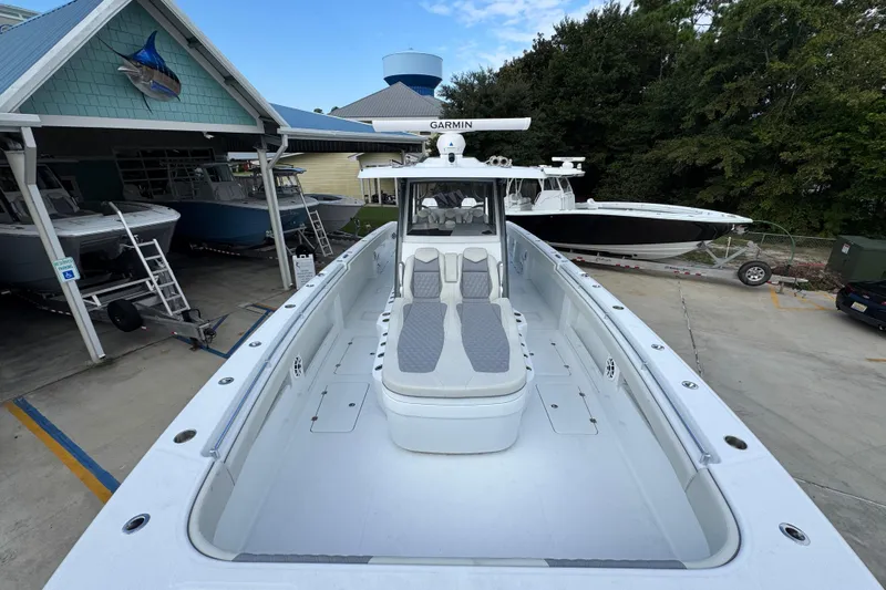 Slide: The Image of 2026 Invincible 40 Catamaran docked, showcasing spacious deck and modern design. - 19