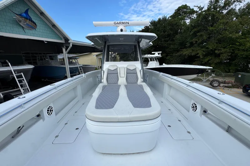 Slide: The Image of 2026 Invincible 40 Catamaran with sleek seating and advanced Garmin navigation system. - 20