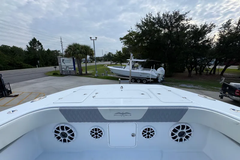 Slide: The Image of 2026 Invincible 40 Catamaran docked, showcasing sleek design and advanced features. - 22