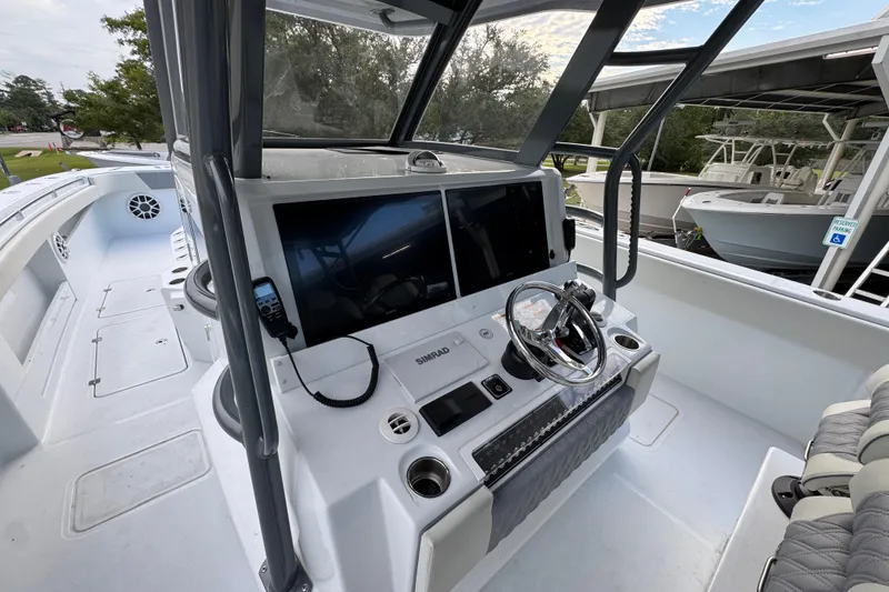 Slide: The Image of 2026 Invincible 40 Catamaran cockpit with advanced navigation system and sleek design. - 30
