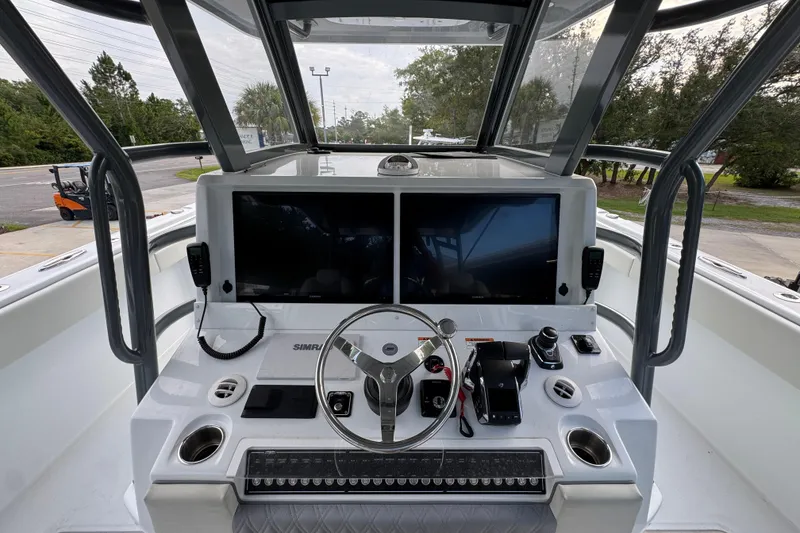 Slide: The Image of Helm of 2026 Invincible 40 Catamaran with advanced navigation displays and controls. - 31