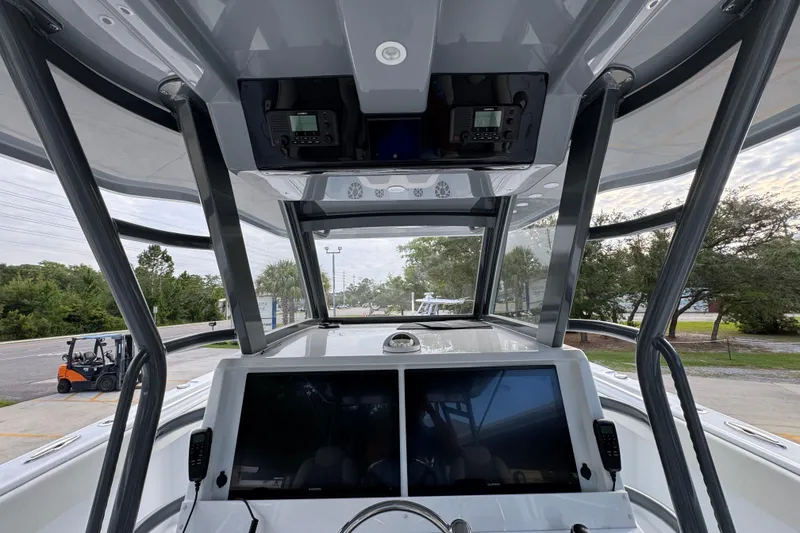 Slide: The Image of Interior view of 2026 Invincible 40 Catamaran cockpit with advanced navigation displays. - 32