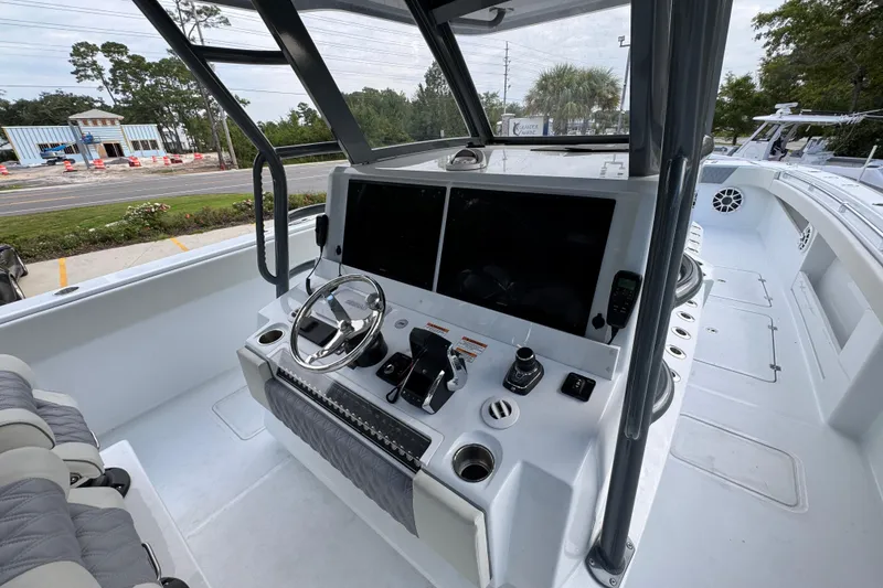 Slide: The Image of Modern helm of 2026 Invincible 40 Catamaran with advanced navigation controls and seating. - 33