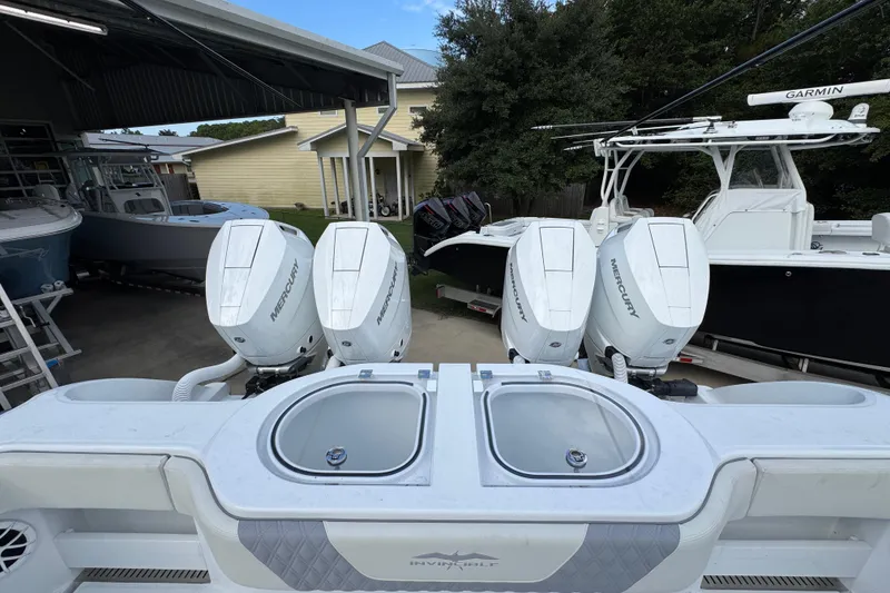 Slide: The Image of 2026 Invincible 40 Catamaran with four Mercury outboard engines in a boatyard. - 39