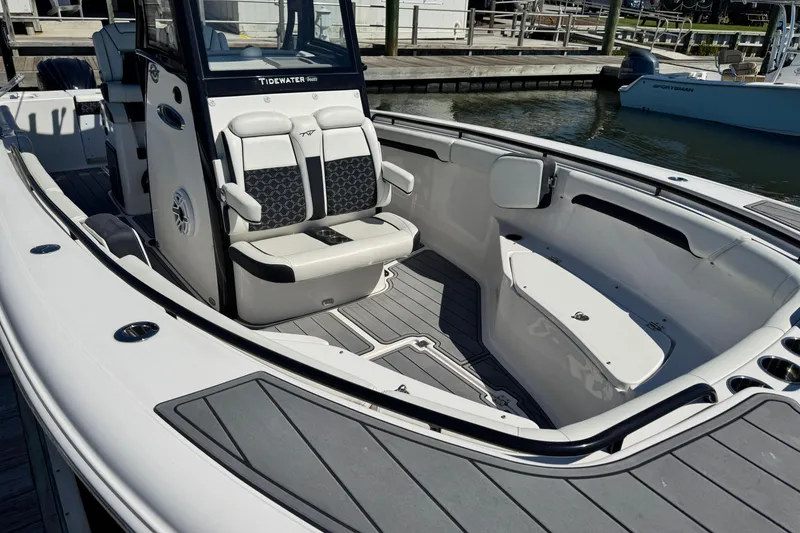 Slide: The Image of 2022 Tidewater 280 CC Adventure boat interior with seating and sleek design. - 5