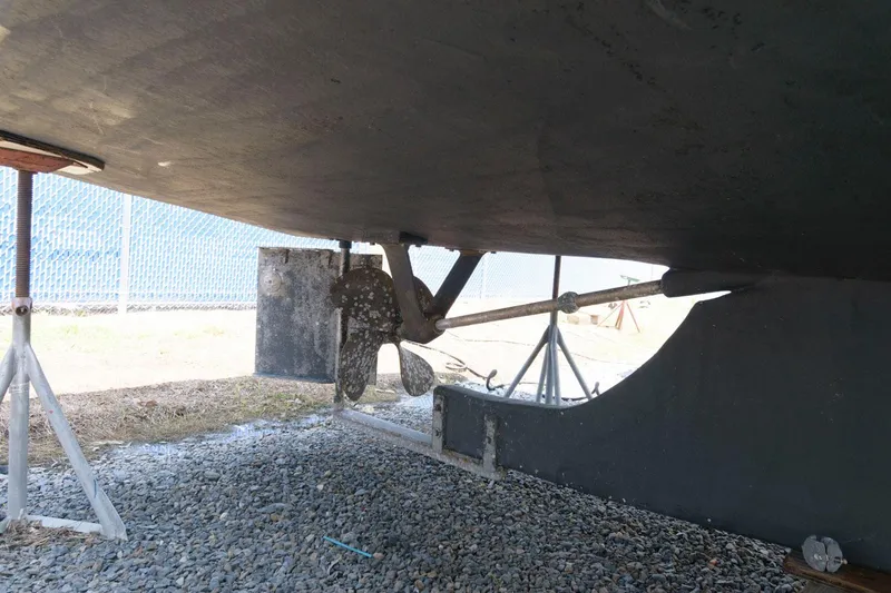 Slide: The Image of Underneath view of 1997 Evans 36 Deadrise boat, showing propeller and rudder. - 19