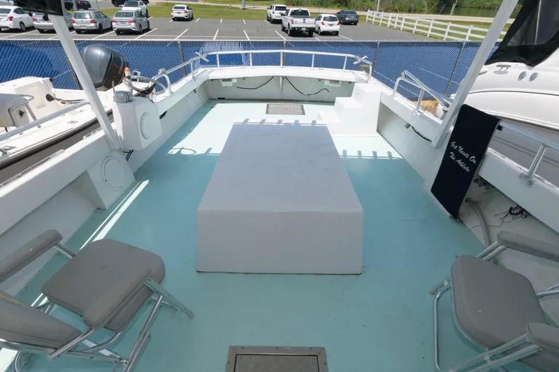 Slide: The Image of Open deck of 1997 Evans 36 Deadrise boat with seating and storage. - 5