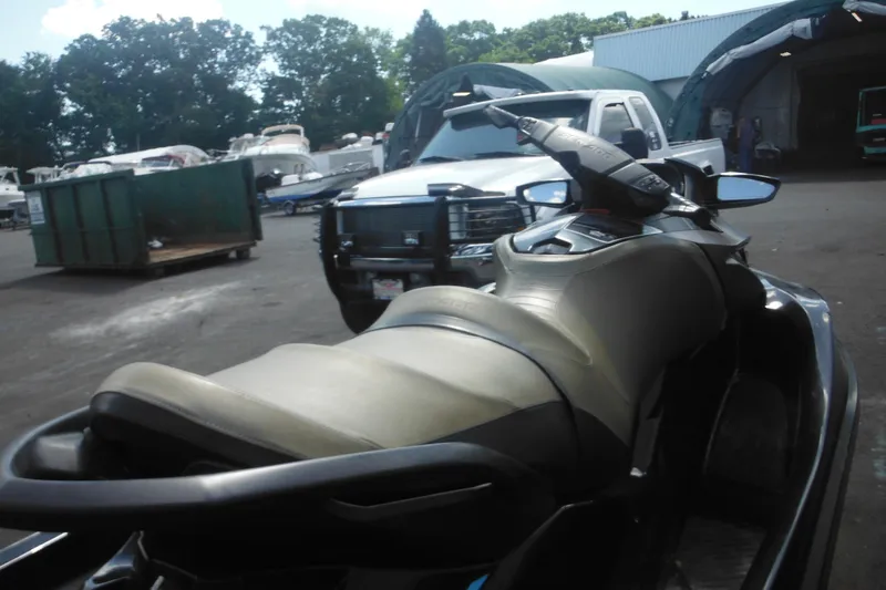 Slide: The Image of 2016 Sea-Doo GTX Limited 300 jet ski parked in a marina lot. - 10