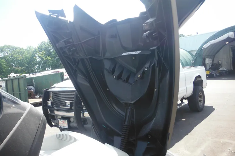 Slide: The Image of 2016 Sea-Doo GTX Limited 300 with open hood, parked near trucks. - 16