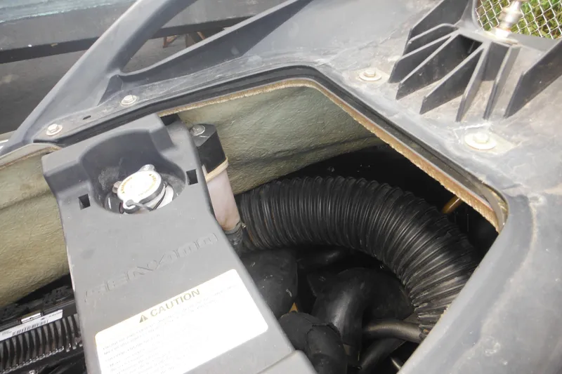 Slide: The Image of Engine compartment of 2016 Sea-Doo GTX Limited 300, showing internal components and caution label. - 22