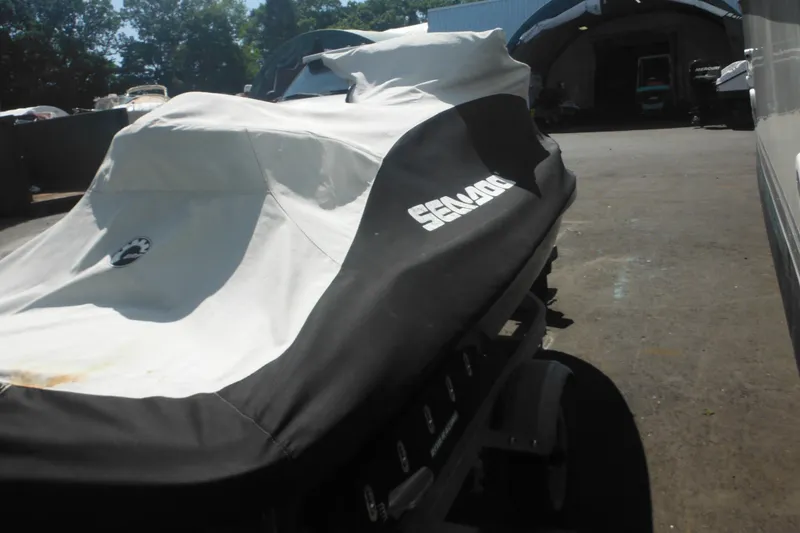 Slide: The Image of 2016 Sea-Doo GTX Limited 300 covered, parked outdoors on a sunny day. - 6