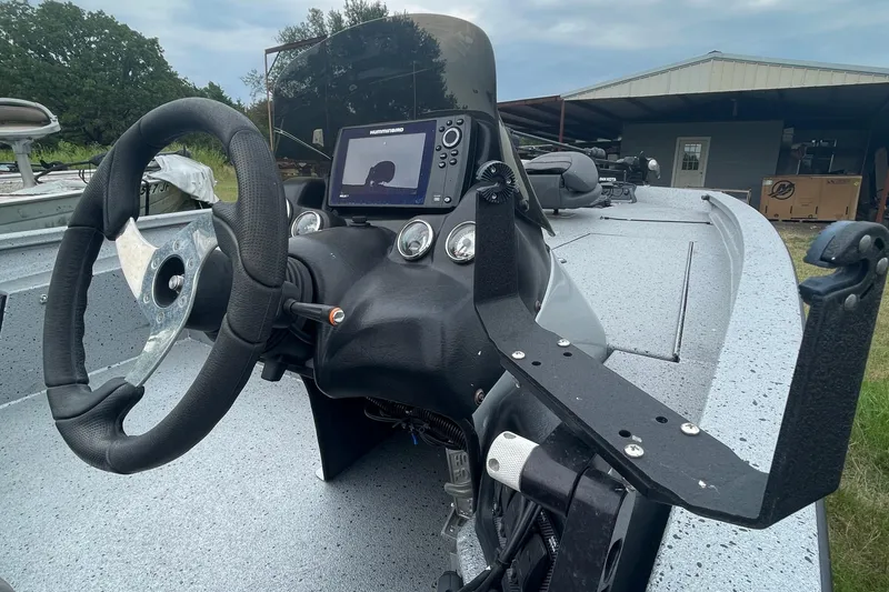 Slide: The Image of Steering console of 2017 Xpress X21 boat with navigation system and controls. - 4