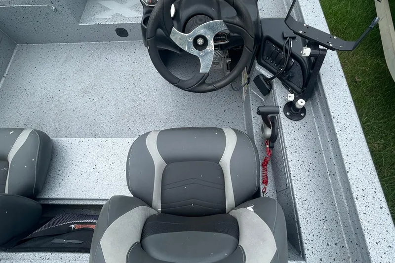 Slide: The Image of 2017 Xpress X21 boat interior with steering wheel and seating. - 9
