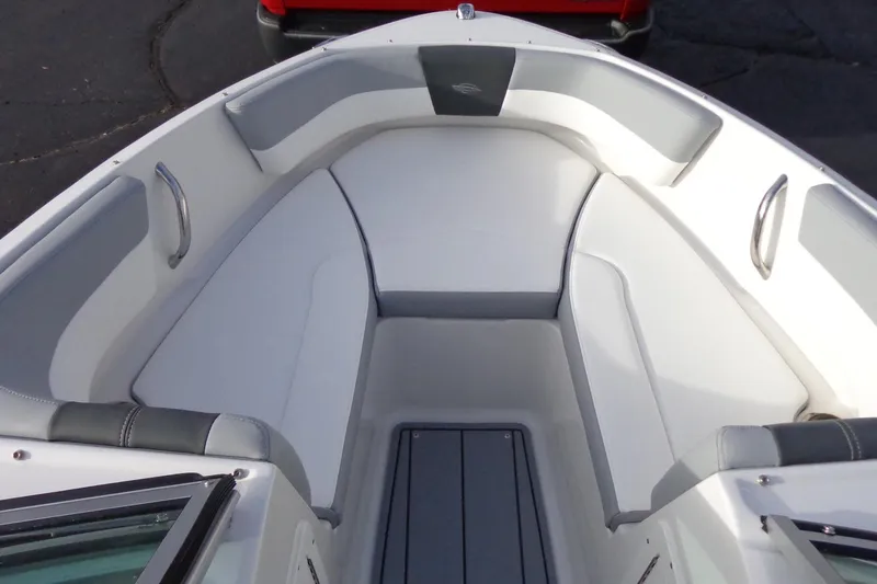 Slide: The Image of 2024 Chaparral 19 SSi OB boat interior with cushioned seating and sleek design. - 11