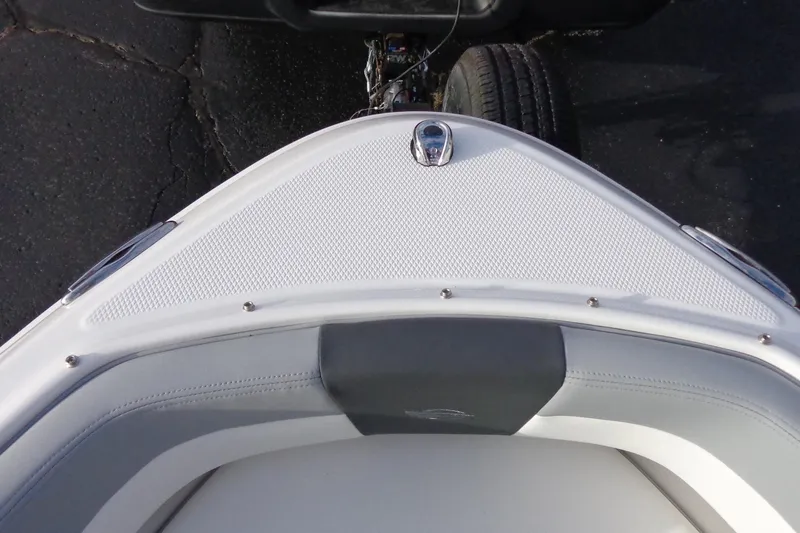 Slide: The Image of 2024 Chaparral 19 SSi OB boat bow with textured deck and seating. - 13