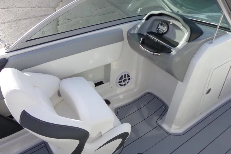 Slide: The Image of 2024 Chaparral 19 SSi OB boat interior with sleek dashboard and comfortable seating. - 15