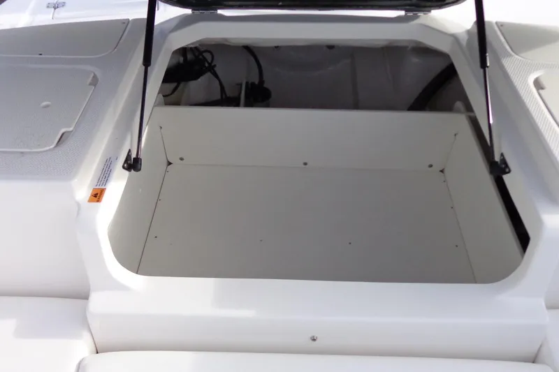 Slide: The Image of 2024 Chaparral 19 SSi OB boat storage compartment, open and spacious design. - 21
